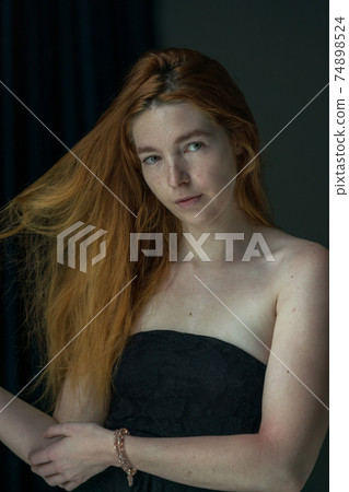 Young Caucasian female model indoor portrait close up 74898524