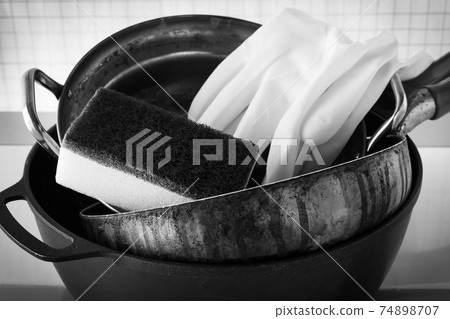 Dirty pans and pans Burnt Oil stains Cooking Housework 74898707