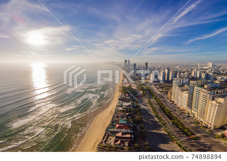 Beautiful My Khe beach from drone in Da Nang, Vietnam, street and buildings near the Central beach and the sea. Photo from a drone 74898894