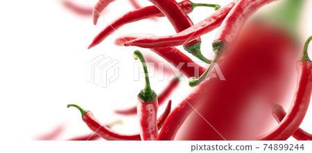 Red hot pepper levitates on a white background Red hot pepper levitates on a white background 74899244