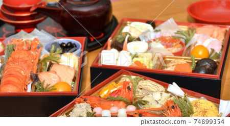 Osechi and Japanese dishes on the table Osechi and Japanese dishes on the table 74899354