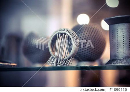 Object printed from metal powder on metal 3d printer. Object printed from metal powder on metal 3d printer. 74899556