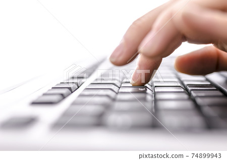 Business woman typing on keyboard 74899943