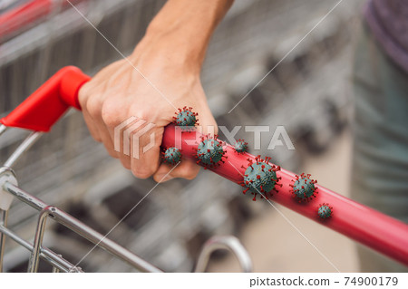 Coronaviruses Covid-19 on a trolley handle in a supermarket, during the pandemic of Coronavirus 74900179