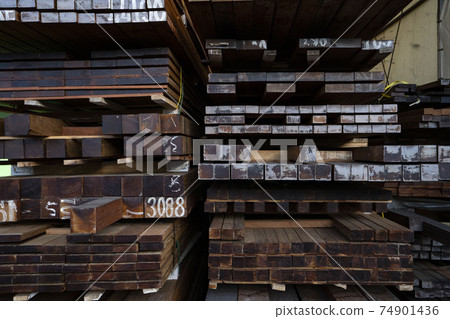 Timber piled up at a lumber shop Timber piled up at a lumber shop 74901436