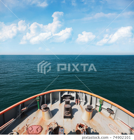 Bow of a boat and seawater under cloudy sky on a sunny day Bow of a boat and seawater under cloudy sky on a sunny day 74902101