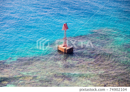 Red warning navigation tower is on the coast of Persian Gulf Red warning navigation tower is on the coast of Persian Gulf 74902104