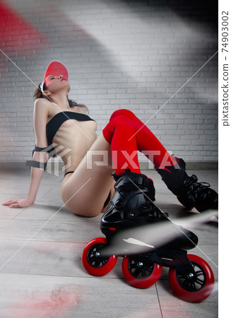 naked slender woman in roller skates red and black color scheme naked slender woman in roller skates red and black color scheme 74903002