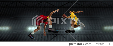 Young basketball players in competitive fight, motion in flight on black background, look from the bottom. Concept of sport, movement, energy and dynamic. Young basketball players in competitive fight, motion in flight on black background, look from the bottom. Concept of sport, movement, energy and dynamic. 74903004