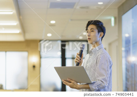 Male business giving a presentation Male business giving a presentation 74903441