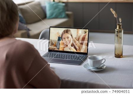 Using laptop for online communication 74904051