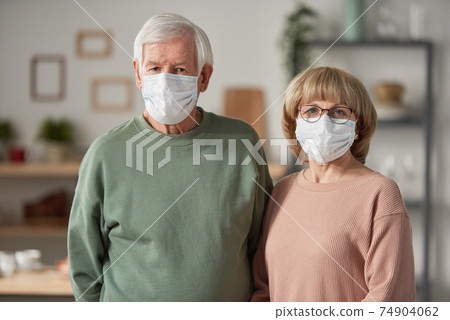 Senior couple in masks 74904062