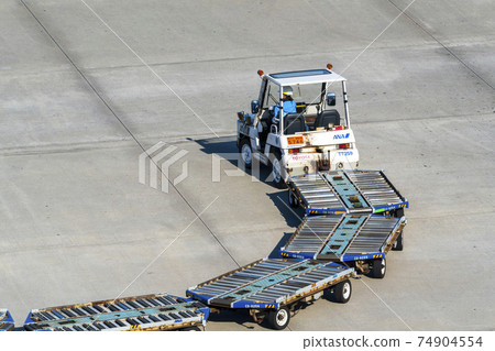 Airport scenery Towing tractor and dolly Ota-ku, Tokyo 74904554