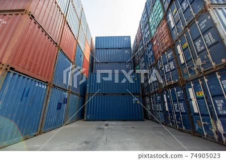 Containers box from Cargo at harbor.Foreman control Industrial Container Cargo freight ship at industry.Transportation and logistic concept. Containers box from Cargo at harbor.Foreman control Industrial Container Cargo freight ship at industry.Transportation and logistic concept. 74905023