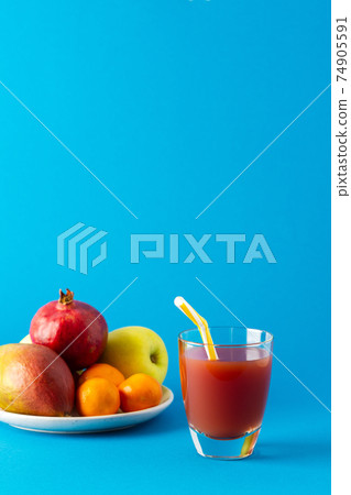 Juices in glasses and ripe fruits Juices in glasses and ripe fruits 74905591