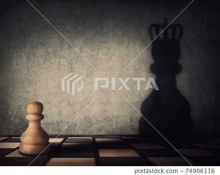 Surreal transformation of the pawn chess piece into a powerful king or queen. Motivation and self confidence metaphor, overcoming obstacles and achieving success. Leadership and authority concept Surreal transformation of the pawn chess piece into a powerful king or queen. Motivation and self confidence metaphor, overcoming obstacles and achieving success. Leadership and authority concept 74906116