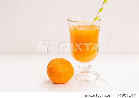 Fresh tropical fruits and glass of juice on white background. Fresh tropical fruits and glass of juice on white background. 74907147