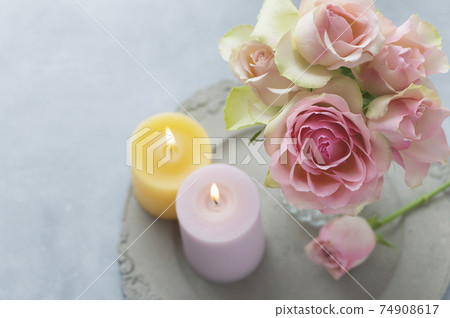 Pink roses and candles Pink roses and candles 74908617