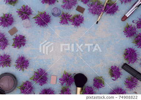 Makeup blusher rouge, brushes, lipstick, eye shadow  with violet bergamot flower 74908822