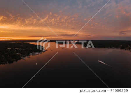 sunset shot of the Wannsee in Berlin with sailing boats 74909269