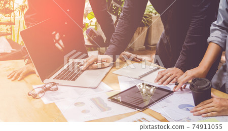 Start up business. people team work meeting point to discuss the graph up and down of economy and work on laptop. Start up business. people team work meeting point to discuss the graph up and down of economy and work on laptop. 74911055