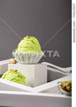 Scoop of homemade pistachio ice cream Scoop of homemade pistachio ice cream 74912037
