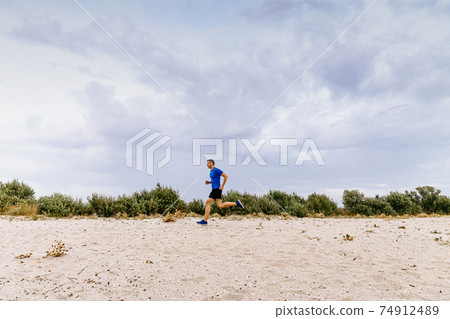 middle-aged male runner running middle-aged male runner running 74912489