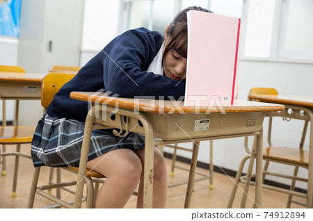 High school girl dozing in class 74912894