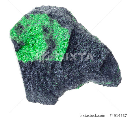 Uvarovite crystals on raw rock on white 74914587