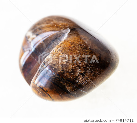 polished ox's eye (bull's eye, tiger's eye) stone polished ox's eye (bull's eye, tiger's eye) stone 74914711
