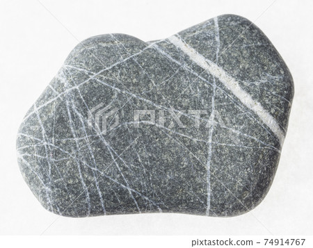 pebble from graywacke stone on white 74914767