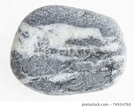 pebble from banded Gneiss stone on white 74914768