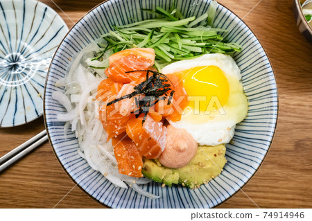top view of bibimbap with salmon sashimi 74914946