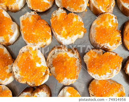 many butterbrots with red caviar on tray 74914956