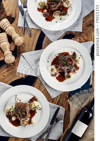 Gourmet appetizer: Beautifully decorated catering banquet foie gras with berries 74915355