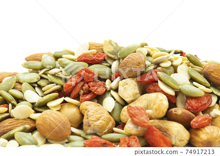 Close up assorted nuts are almonds, sunflower seeds, melon seeds, cashews, seasoned kee. 74917213