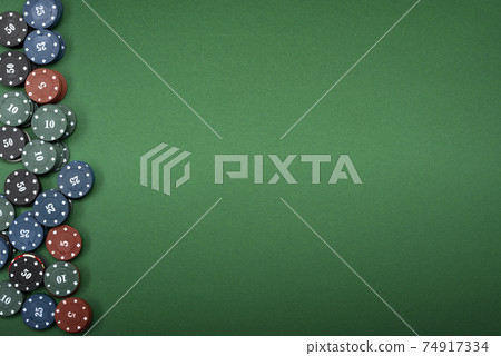 casino chips on green background with place for text casino chips on green background with place for text 74917334