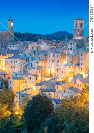 View of old town in the evening night with old tradition buildings and illumination. Sorano, Tuscany, Italy 74918584