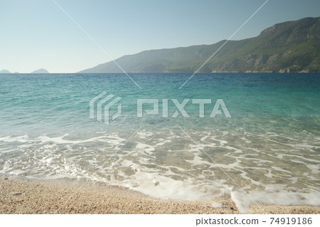 View of rocky island in Mediterranean sea. 74919186