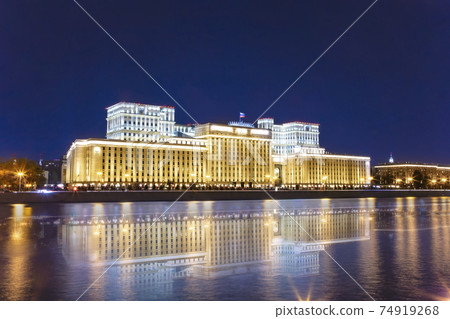 Main Building of the Ministry of Defence of the Russian Federation (Minoboron), at night-- is the governing body of the Russian Armed Forces and Moskva River. Moscow, Russia 74919268