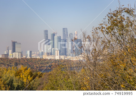 View of the city and the complex of skyscrapers Moscow city from Sparrow Hills or Vorobyovy Gory observation (viewing) platform-- is on a steep bank 85 m above the Moskva river, or 200 m above sea View of the city and the complex of skyscrapers Moscow city from Sparrow Hills or Vorobyovy Gory observation (viewing) platform-- is on a steep bank 85 m above the Moskva river, or 200 m above sea 74919995
