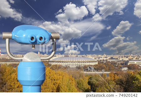 Touristic telescope viewer (binoculars) and view of central Moscow from Sparrow Hills or Vorobyovy Gory observation (viewing) platform Touristic telescope viewer (binoculars) and view of central Moscow from Sparrow Hills or Vorobyovy Gory observation (viewing) platform 74920142