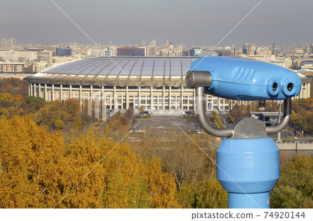 Touristic telescope viewer (binoculars) and view of central Moscow from Sparrow Hills or Vorobyovy Gory observation (viewing) platform 74920144
