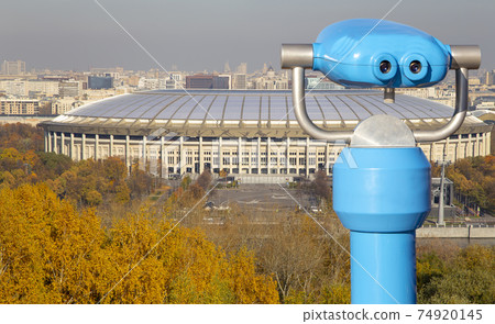 Touristic telescope viewer (binoculars) and view of central Moscow from Sparrow Hills or Vorobyovy Gory observation (viewing) platform 74920145