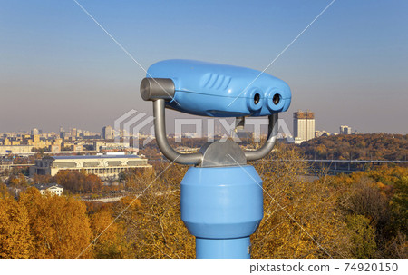 Touristic telescope viewer (binoculars) and view of central Moscow from Sparrow Hills or Vorobyovy Gory observation (viewing) platform 74920150