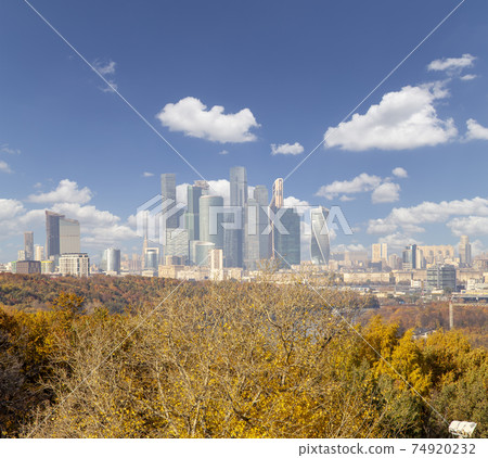 View of the city and the complex of skyscrapers Moscow city from Sparrow Hills or Vorobyovy Gory observation (viewing) platform-- is on a steep bank 85 m above the Moskva river, or 200 m above sea 74920232