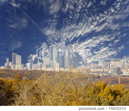 View of the city and the complex of skyscrapers Moscow city from Sparrow Hills or Vorobyovy Gory observation (viewing) platform-- is on a steep bank 85 m above the Moskva river, or 200 m above sea View of the city and the complex of skyscrapers Moscow city from Sparrow Hills or Vorobyovy Gory observation (viewing) platform-- is on a steep bank 85 m above the Moskva river, or 200 m above sea 74920233