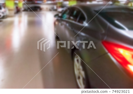 Car parking blurred. Empty road asphalt background in soft focus. Car lot parking space in underground city garage. Urban, Rough Under-construction Background. 74923021