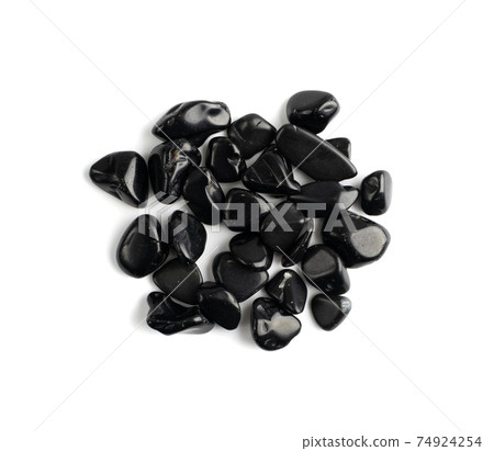 Black onyx pebbles isolated, polished hematite gem stones Black onyx pebbles isolated, polished hematite gem stones 74924254