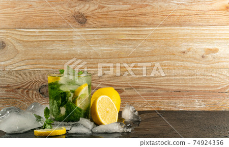 Cold iced mojito, lemon water drink, mint lemonade Cold iced mojito, lemon water drink, mint lemonade 74924356